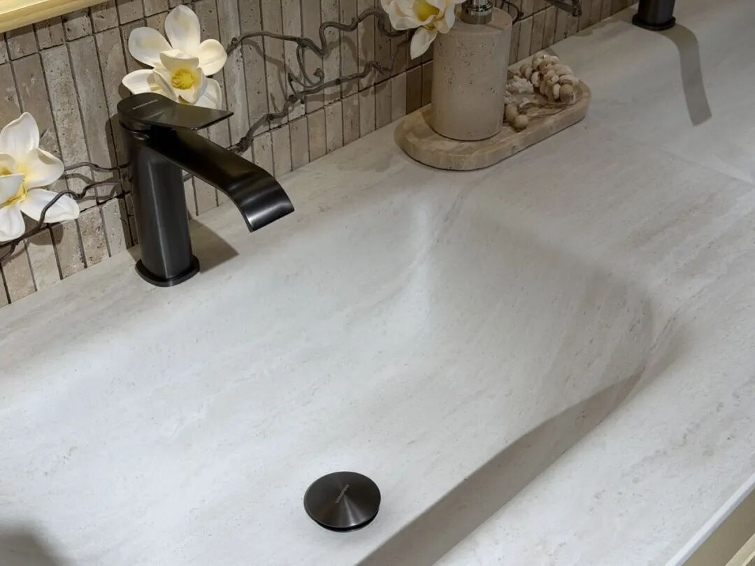 Modern bathroom vanity with wood-grain cabinet, white basin, and round mirror at 2026 Shanghai Kitchen & Bath Expo