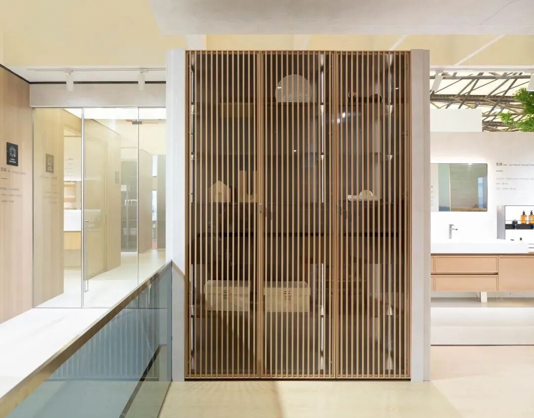 Modern bathroom vanity with wood-grain cabinet, vessel sink, and round mirror at 2026 Shanghai KBC Expo